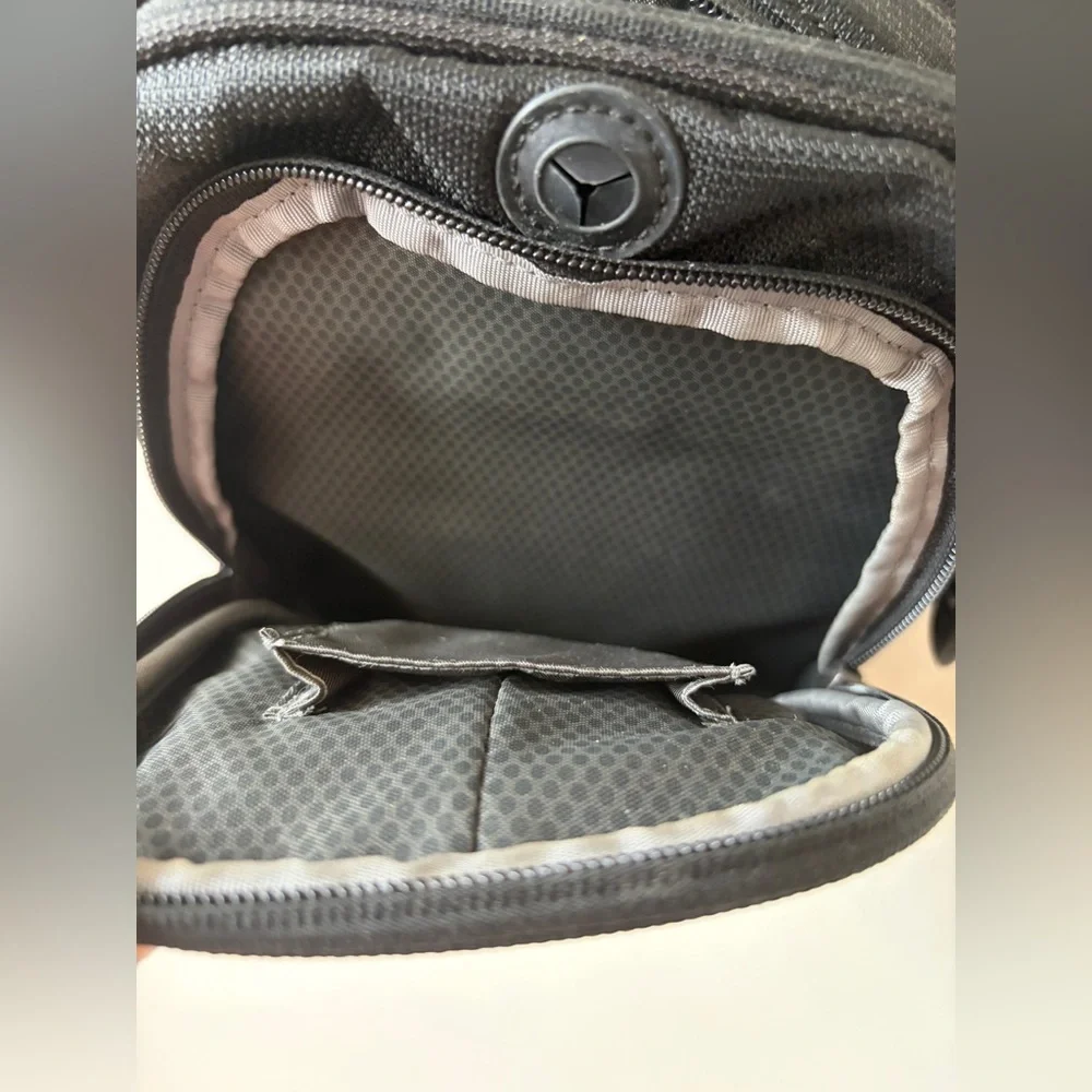 Tumi T-Tech sling bag with multiple compartments and Keychain mens